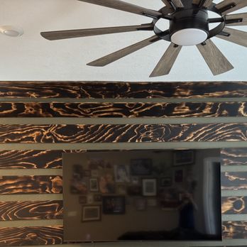 RJ Home Services - Custom wood wall treatment with shou sugi ban charring technique, oversized ceiling fan hung, 80" TV hung. - Handyman Near Me RJ Home Services - Custom wood wall treatment with shou sugi ban charring technique, oversized ceiling fan hung, 80" TV hung. - Handyman Near Me