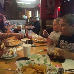 a group of people eating at a restaurant