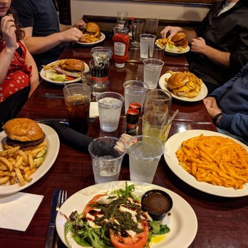 McCloskey's Tavern - a group of people sitting at a table with plates of food - Bars Near Me - Ardmore, Pennsylvania McCloskey's Tavern - a group of people sitting at a table with plates of food - Bars Near Me - Ardmore, Pennsylvania