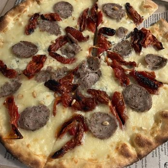 Calabrese - Four cheese pizza with roasted tomatoes and Italian sausage - Italian Near Me - Southlake, Texas