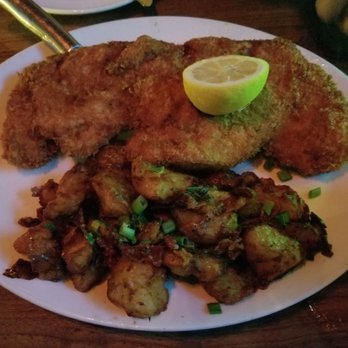 Yard House - Chicken schnitzel and potato salad - New American Near Me - Honolulu, Hawaii Yard House - Chicken schnitzel and potato salad - New American Near Me - Honolulu, Hawaii