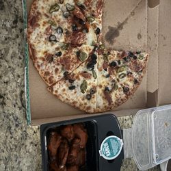 Papa Johns Pizza - Large pizza with pepperoni jalapeños and black olives with a side of wings.