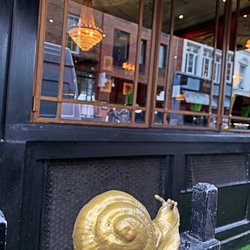 Soho District - SOHO District in the City of Westminster, part of the West End of London. Obviously serves escargot...