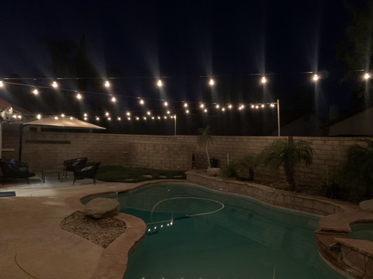 Bistro Lighting - During the off season for Christmas Lights, we specialize in backyard bistro lighting & string lighting! We use guide wires for a secure tight fit, custom cut the lights to fit the design pattern.  In addition, we will use poles anchored to walls to optimize the head height of your lights so it doesn't feel like they are on top of you. We finalize your design with a remote control based option to make it easy to turn on and off the lights from inside your house.