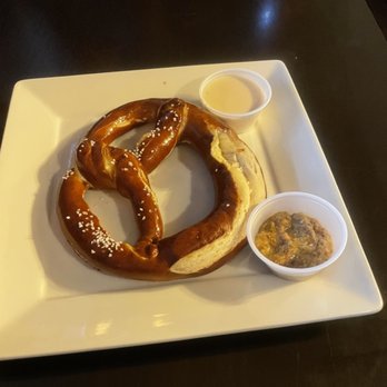 Colchuck's - Big pretzel with beer cheese and grain mustard. I loved the mustard dipping sauce personally. - German Near Me - Leavenworth, Washington Colchuck's - Big pretzel with beer cheese and grain mustard. I loved the mustard dipping sauce personally. - German Near Me - Leavenworth, Washington