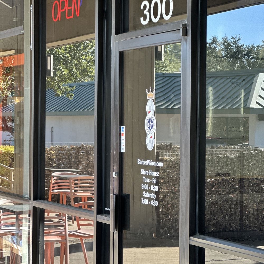 Barber Vision - Closer image of front door as you walk up. you can see their logo and the open sign lit up. - Barbers Near Me - Austin, Texas Barber Vision - Closer image of front door as you walk up. you can see their logo and the open sign lit up. - Barbers Near Me - Austin, Texas