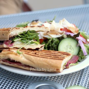 The Museum Cafe - Apple Brie Baguette ($9.99) - Granny Smith apple slices, Brie, and caramelized red onions, topped with arugula, grilled on a French baguette - Coffee & Tea Near Me - Salt Lake City, Utah The Museum Cafe - Apple Brie Baguette ($9.99) - Granny Smith apple slices, Brie, and caramelized red onions, topped with arugula, grilled on a French baguette - Coffee & Tea Near Me - Salt Lake City, Utah