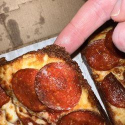 Little Ceasar's Pizza - In the picture, it's a square pizza. No squares here because there is no crust and what little crust there is was burned