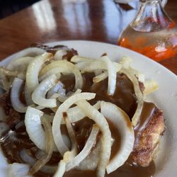 Pork chops with gravy and onions