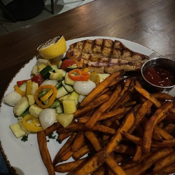 District - Salmon with veggies and sweet potato fries . Delish !! Nice portion - Cocktail Bars Near Me - Los Angeles, California