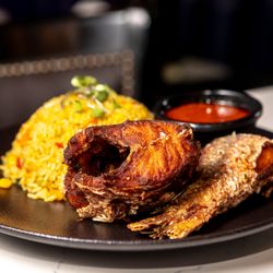 Lagos TSQ - Delicious Jollof Rice, a classic West African dish paired with fried fish