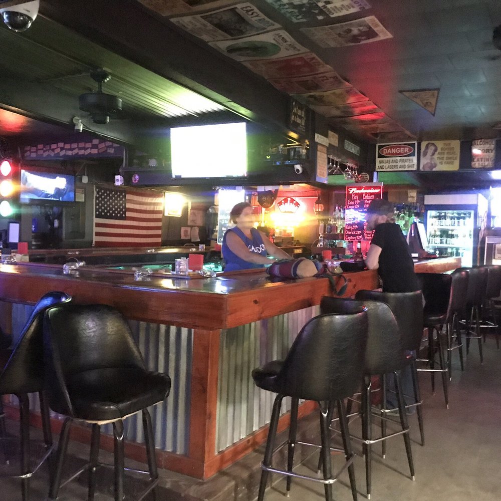 The Fat Cat Saloon - a man sitting at the bar - Bars Near Me - Prairieville, Louisiana The Fat Cat Saloon - a man sitting at the bar - Bars Near Me - Prairieville, Louisiana