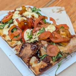 Aarhus Street Food - Flatbread with mozzarella, balsamic, arugula, and tomatoes