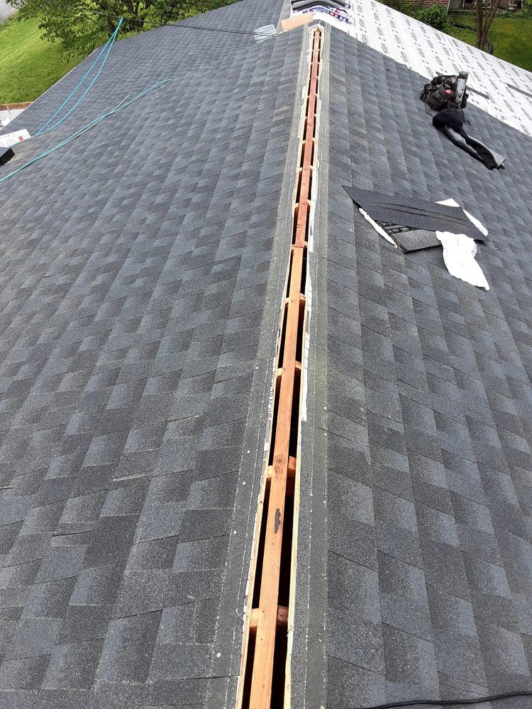 Slide of C & J Roofing