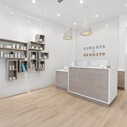 SUGARED + BRONZED - S+B Williamsburg product shelves and reception desk