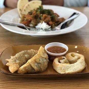 Museum Cafe - a plate of dumplings and a bowl of dipping sauce - Sandwiches Near Me - Chicago, Illinois