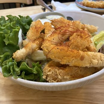Nua Thai Kitchen - Crispy calamari with house made tum yum rub. Whole thing is topped with saffron - Thai Near Me - Oakland, California Nua Thai Kitchen - Crispy calamari with house made tum yum rub. Whole thing is topped with saffron - Thai Near Me - Oakland, California
