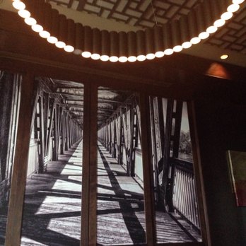 Ruth's Chris Steak House - Giant artwork and one of the light fixtures in our dining area. - Steakhouses Near Me - Tulsa, Oklahoma Ruth's Chris Steak House - Giant artwork and one of the light fixtures in our dining area. - Steakhouses Near Me - Tulsa, Oklahoma