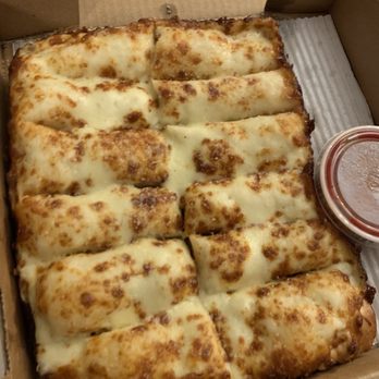 Fonzarelli's Pizza - Cheese Bread topped with Parmesan & garlic butter (Amazing!!) - Pizza Near Me - Wixom, Michigan