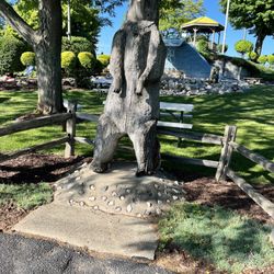 Putters Creek - An interesting bear statue in front of the mini golf course