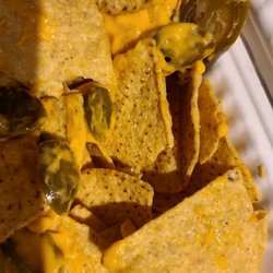 Nachos. Mostly eaten already. Could have used a little more cheese. Still good.