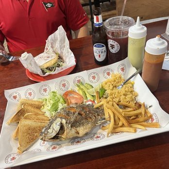 Taqueria Taxco - Mojarra Frita Combo, Gordita de Beef Fajita, and Jamaica (drink) with table salsas and cold, bottled beer - Mexican Near Me - Arlington, Texas Taqueria Taxco - Mojarra Frita Combo, Gordita de Beef Fajita, and Jamaica (drink) with table salsas and cold, bottled beer - Mexican Near Me - Arlington, Texas