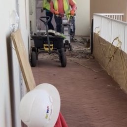 Workers removing tiles with a jackhammer at Lighthouse Condominiums. Unit 1202. (11/1/21 ) Workers removing tiles with a jackhammer at Lighthouse Condominiums. Unit 1202. (11/1/21 )