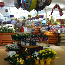 a display of flowers and balloons a display of flowers and balloons