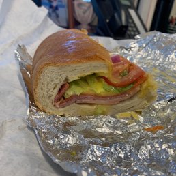 a ham sandwich with lettuce and tomato a ham sandwich with lettuce and tomato