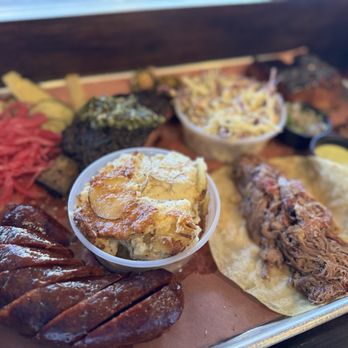 Interstellar BBQ - Beef kielbasa, lamb taco, scalloped potatoes, short rib beef, pork belly and jalapeño slaw - Barbeque Near Me - Austin, Texas