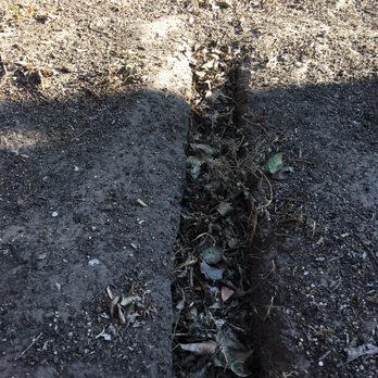ProTech Landscaping - a section of a garden that has been dug into the ground - Landscaping Near Me ProTech Landscaping - a section of a garden that has been dug into the ground - Landscaping Near Me