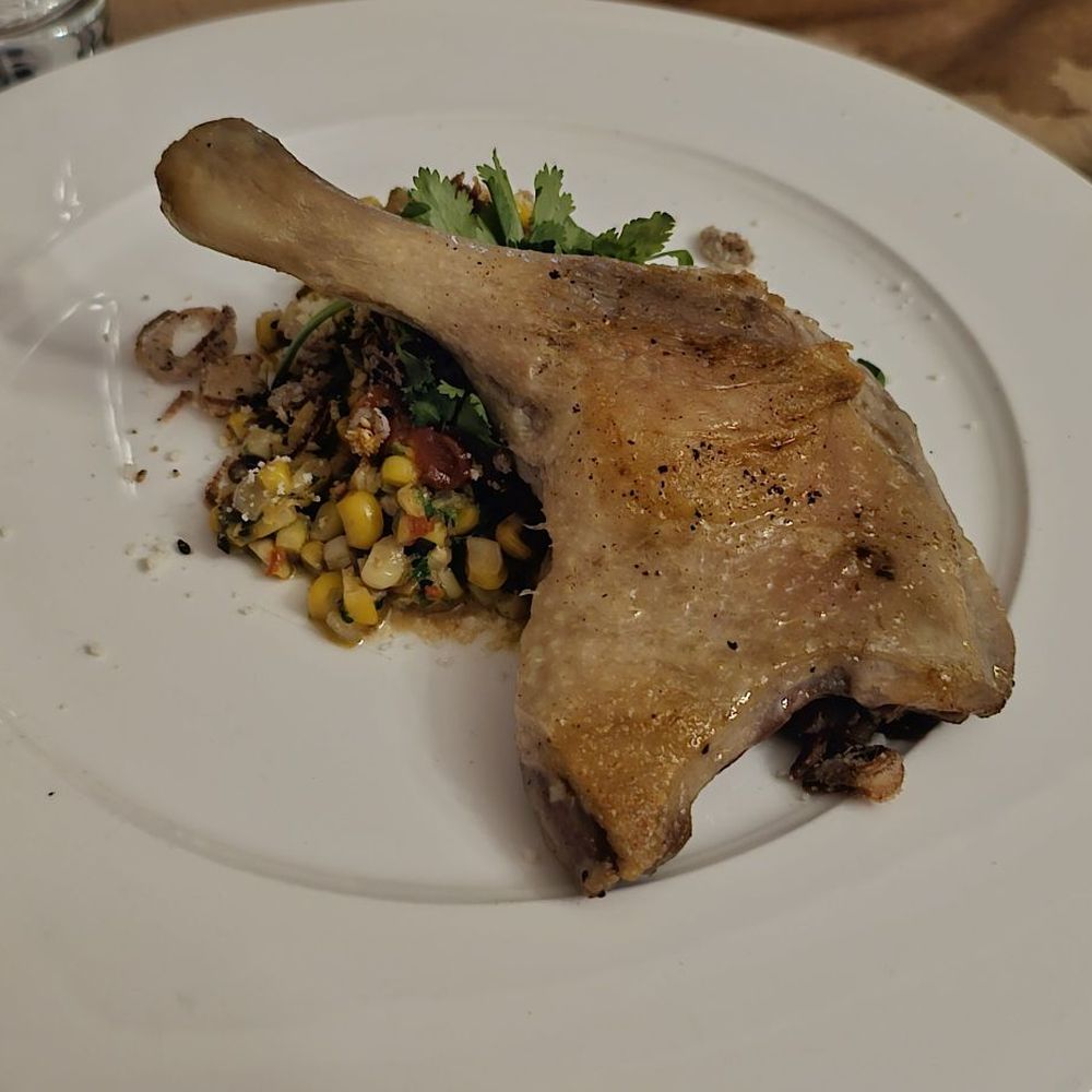 Boucherie - Crispy Skin Duck Confit with charred street corn, tomato jam, and cotija - Barbeque Near Me - New Orleans, Louisiana