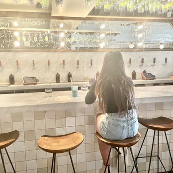 TØRST - a woman sitting at a bar - Pubs Near Me - Brooklyn, New York