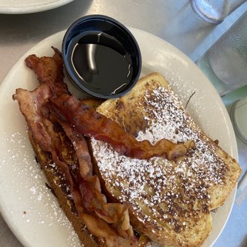 Harpoon Harry's - French toast covered in powdered sugar, with a side of bacon and syrup. - Breakfast & Brunch Near Me - Key West, Florida