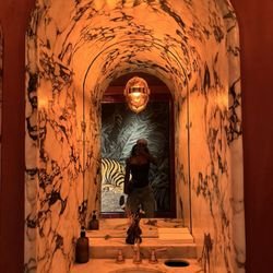 Crying Tiger - The bathroom is a 20/10 very mood and deep orange.