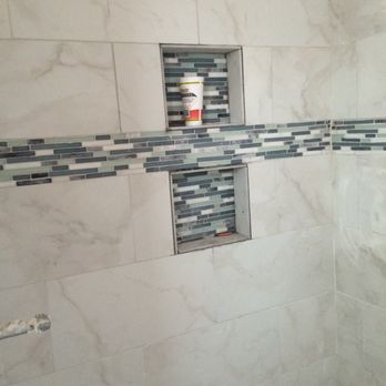 Sowell Enterprises - a shower with a tile accent - General Contractors Near Me - Panama City Beach, Florida Sowell Enterprises - a shower with a tile accent - General Contractors Near Me - Panama City Beach, Florida