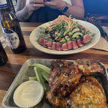 BJ's Restaurant & Brewhouse - Sauced 'n' tossed chicken thighs (Garlic Parmesan) Seared Ahi tuna salad - Pizza Near Me - Salinas, California