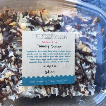 Hillbilly Farms Bakery - a plastic container filled with coconut squares - Bakeries Near Me - Dade City, Florida