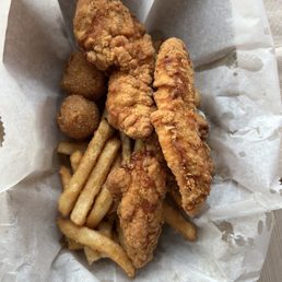 Chicken basket with hush puppies (2) and fries (little seasoning). Really good Chicken basket with hush puppies (2) and fries (little seasoning). Really good