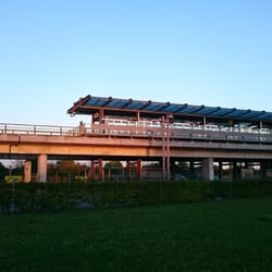 Bella Center Station - Station facade with the setting sun.
