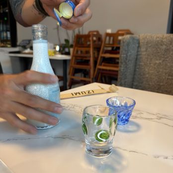 Izumi Sushi - Pouring sake in glasses that we got to choose!!! - Sushi Bars Near Me - Castle Rock, Colorado Izumi Sushi - Pouring sake in glasses that we got to choose!!! - Sushi Bars Near Me - Castle Rock, Colorado