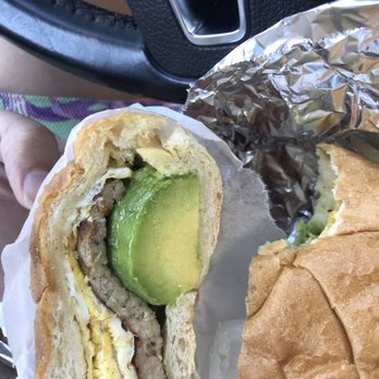 Parkside Market - a half eaten sandwich with an avocado - Delis Near Me - Astoria, New York