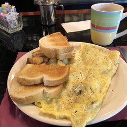 Kasey's On The Delaware - Mushroom & Provolone omelette w/ sour dough bread and home fries.