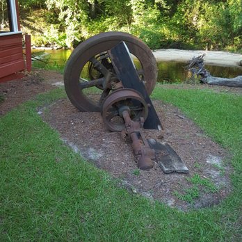 The Creekside Mill - Old mill parts outside. - Comfort Food Near Me - Raeford, North Carolina