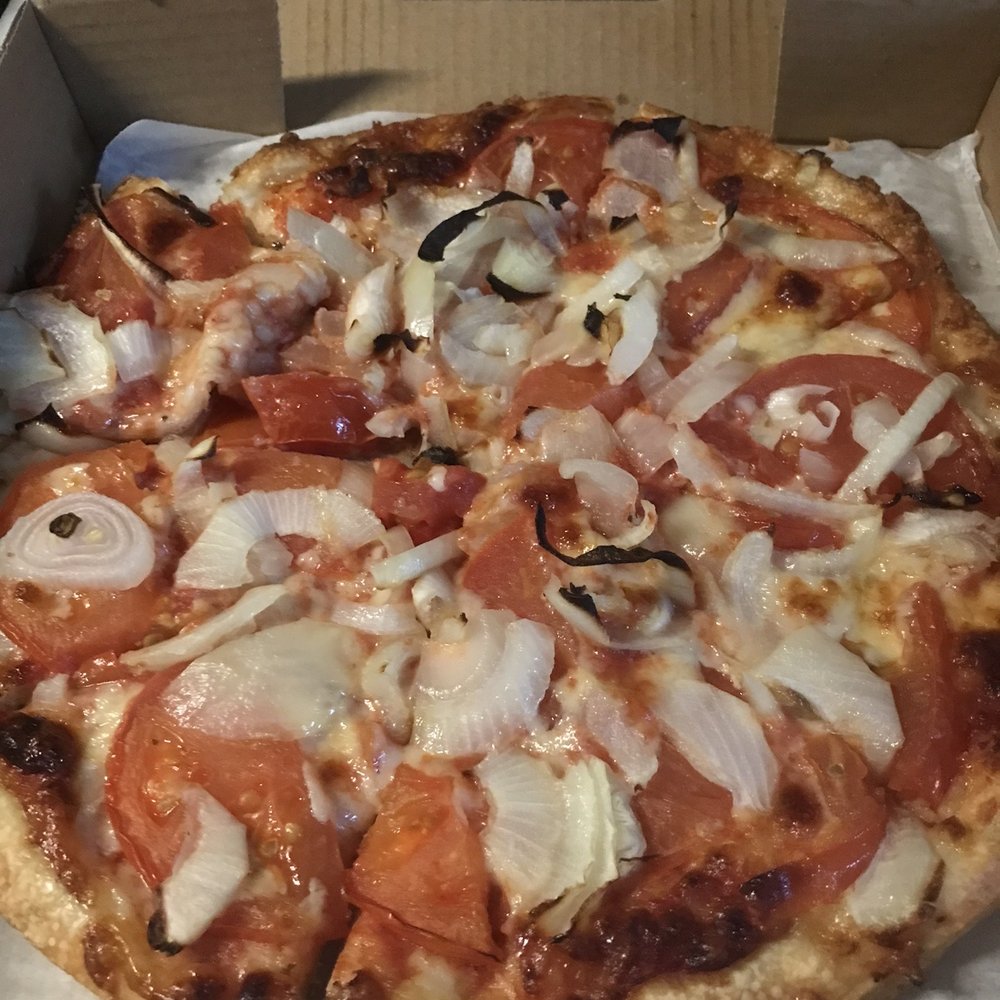 Sliced tomatoes and onions pizza. Sliced tomatoes and onions pizza.