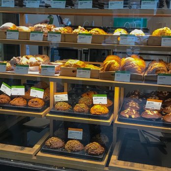 JJ Bean - a display of baked goods in a bakery - Coffee Roasteries Near Me - Vancouver, British Columbia JJ Bean - a display of baked goods in a bakery - Coffee Roasteries Near Me - Vancouver, British Columbia