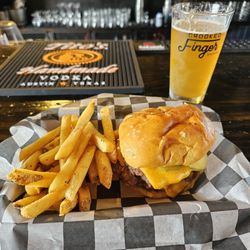 Crooked Finger Brewing - This is the double smash burger with fries! Absolutely finger smacking good.