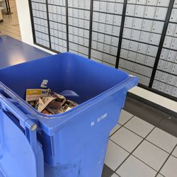 US Post Office - 4 wheely bins for the trash USPS delivers to PO boxes.