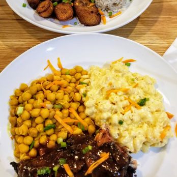 Pimenta - Top: Chicken Stew in Brown Sauce w/ Rice & Peas and Plantains; Bottom: Jerk Chicken w/ Mac & Cheese and Dunn's River Beans - Caribbean Near Me - Fredericksburg, Virginia