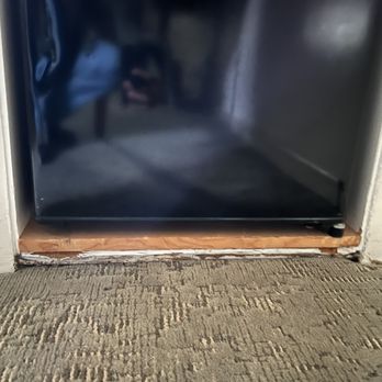 Beverly Laurel Hotel - Mini Fridge area in Room with paint peeling from being wet with mold under the fridge. - Hotels Near Me - Los Angeles, California